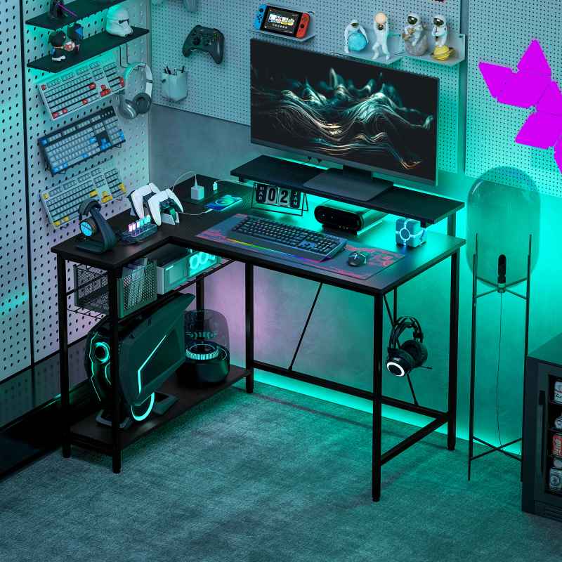 HOMCOM L Shaped Gaming Desk with LED Lights, Power Outlet, USB Charging Ports, 107cm Reversible Corner Computer Desk with Storage Shelves, Monitor Stand for Home Office, Small Space, Black